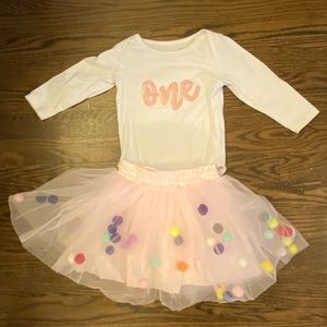 Little girl 1st birthday outfit. Long sleeve onesie with pompom skirt